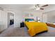 Bright primary bedroom with a ceiling fan, neutral walls, carpeted floor and walk-in closet at 2109 S Luther --, Mesa, AZ 85209