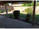 Flagstone back patio overlooks lush lawn, desert landscaping and trees at 2434 S Colleen --, Mesa, AZ 85210