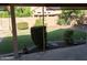 Serene backyard featuring lush greenery, mature trees, and a peaceful patio area at 2434 S Colleen --, Mesa, AZ 85210