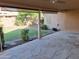 Flagstone back patio overlooks lush lawn, desert landscaping and mature tree at 2434 S Colleen --, Mesa, AZ 85210
