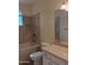 Bright bathroom featuring a shower-tub, toilet, and vanity with elegant fixtures under soft lighting at 2434 S Colleen --, Mesa, AZ 85210