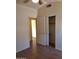 Bright bedroom features a spacious closet, neutral walls, and wood-look tile flooring at 2434 S Colleen --, Mesa, AZ 85210