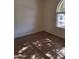 Bedroom featuring a large arched window, and wood-look tile flooring at 2434 S Colleen --, Mesa, AZ 85210