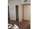 Bedroom featuring a closet and wood-look tile flooring at 2434 S Colleen --, Mesa, AZ 85210
