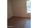 Cozy bedroom with light walls, wooden flooring, and a window that offers ample natural light at 2434 S Colleen --, Mesa, AZ 85210