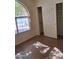 Bedroom featuring a large arched window, closet and wood-look tile flooring at 2434 S Colleen --, Mesa, AZ 85210