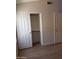 Bedroom closet with rod and shelving, offering simple storage solutions and modern interior design at 2434 S Colleen --, Mesa, AZ 85210