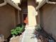 Welcoming front entrance with desert landscaping, a decorative door, and an arched window at 2434 S Colleen --, Mesa, AZ 85210