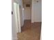 Neutral hallway with tile flooring, open doors, and well-lit space at 2434 S Colleen --, Mesa, AZ 85210