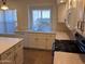 Bright kitchen featuring white cabinets, countertops and window above sink at 2434 S Colleen --, Mesa, AZ 85210
