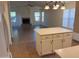 Open concept kitchen island view towards the living room that features a cozy fireplace at 2434 S Colleen --, Mesa, AZ 85210