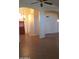 The living area with arched entranceways showcases the home's open and airy design, featuring stylish tile floors at 2434 S Colleen --, Mesa, AZ 85210