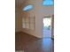 Spacious living room with windows, tile flooring, and a door to the patio at 2434 S Colleen --, Mesa, AZ 85210