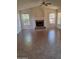Spacious living room with fireplace, high ceilings and neutral tile flooring at 2434 S Colleen --, Mesa, AZ 85210