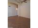 Open living room featuring a ceiling fan, neutral walls, and tile flooring at 2434 S Colleen --, Mesa, AZ 85210