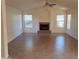 Open-concept living room with a fireplace and lots of natural light at 2434 S Colleen --, Mesa, AZ 85210