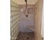 Shower featuring glass block wall, updated shower head, and a tiled seat at 2434 S Colleen --, Mesa, AZ 85210