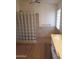 Close up of shower with glass block wall and updated fixtures and tile at 2434 S Colleen --, Mesa, AZ 85210