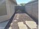 Side yard featuring a rock landscape and paver pathway at 2434 S Colleen --, Mesa, AZ 85210