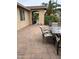 View of patio with dining table, chairs, and covered entrance at 2585 E Carob Dr, Gilbert, AZ 85298