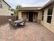 View of patio with dining table, chairs, and covered entrance at 2585 E Carob Dr, Gilbert, AZ 85298