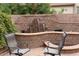 Backyard patio with a waterfall feature at 2585 E Carob Dr, Gilbert, AZ 85298