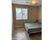Bedroom featuring a ceiling fan and large window for natural light at 2585 E Carob Dr, Gilbert, AZ 85298