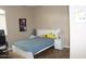 Bedroom with ceiling fan, window, and tile floor at 2585 E Carob Dr, Gilbert, AZ 85298