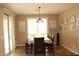 Cozy dining room with bench seating, chandelier, and sliding doors leading to the outside at 2585 E Carob Dr, Gilbert, AZ 85298