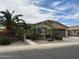 Charming single-story home with a desert landscaped yard and two car garage at 2585 E Carob Dr, Gilbert, AZ 85298