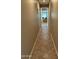 Hallway featuring tiled floor and neutral color scheme throughout at 2585 E Carob Dr, Gilbert, AZ 85298
