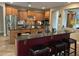 Open kitchen design featuring dark countertops, stainless steel appliances, and barstool seating at 2585 E Carob Dr, Gilbert, AZ 85298