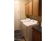 Bright laundry area with washer, dryer, and built in cabinets at 2585 E Carob Dr, Gilbert, AZ 85298