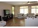 Cozy living room featuring a neutral color palette and large windows, perfect for relaxing at 2585 E Carob Dr, Gilbert, AZ 85298