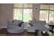 Cozy living room with tile floors, large windows, and seating at 2585 E Carob Dr, Gilbert, AZ 85298