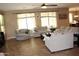 Inviting living room featuring tile flooring, neutral walls and an abundance of seating at 2585 E Carob Dr, Gilbert, AZ 85298