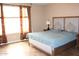 Spacious main bedroom featuring lots of natural light, neutral paint and carpet flooring at 2585 E Carob Dr, Gilbert, AZ 85298