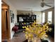 Spacious office showcasing natural light, black bookshelves, and stylish decor at 2585 E Carob Dr, Gilbert, AZ 85298