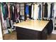 Spacious walk-in closet with custom shelves, drawers, and hanging space at 2585 E Carob Dr, Gilbert, AZ 85298