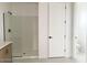 Bathroom featuring a glass shower and toilet behind a door at 26119 N 23Rd Ave, Phoenix, AZ 85085