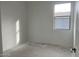 Bright bedroom featuring a window and neutral walls, ideal for personalizing the space at 26119 N 23Rd Ave, Phoenix, AZ 85085