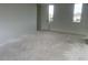 Unfinished bedroom features natural light from two windows at 26119 N 23Rd Ave, Phoenix, AZ 85085