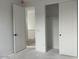 Bright bedroom features an open closet with sliding doors and a staircase view at 26119 N 23Rd Ave, Phoenix, AZ 85085