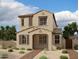 Charming two-story home featuring a tile roof, neutral stucco, and inviting landscaping at 26119 N 23Rd Ave, Phoenix, AZ 85085