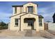 Charming two-story home with a light-colored stucco finish and a covered front porch entry at 26119 N 23Rd Ave, Phoenix, AZ 85085