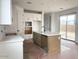 Bright kitchen features an island and stainless steel appliances at 26119 N 23Rd Ave, Phoenix, AZ 85085