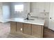 Modern kitchen with white countertops, subway tile, and a central island perfect for cooking at 26119 N 23Rd Ave, Phoenix, AZ 85085