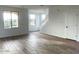 Spacious living room with wood-look flooring and natural light at 26119 N 23Rd Ave, Phoenix, AZ 85085