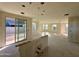 Unfinished spacious living room with natural light, sliding doors and multiple windows at 26119 N 23Rd Ave, Phoenix, AZ 85085