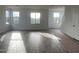 Bright open-concept living space featuring wood-look tile flooring and natural light at 26119 N 23Rd Ave, Phoenix, AZ 85085
